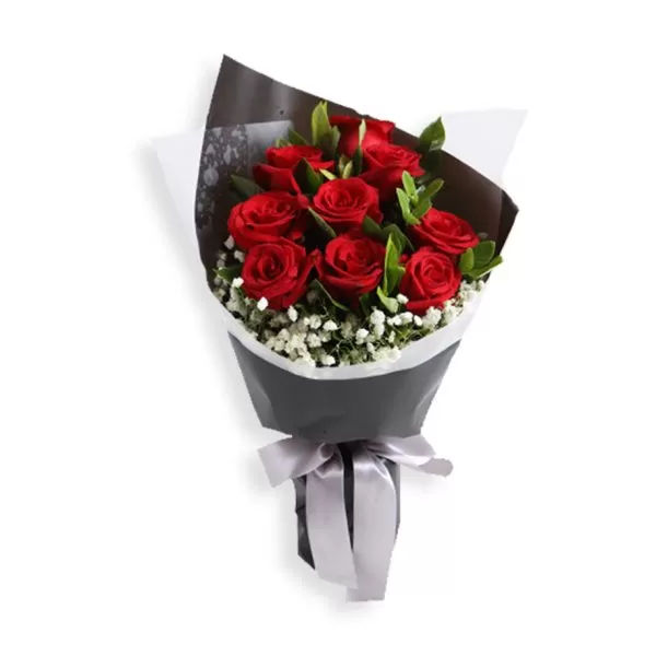 A bouquet of red roses with white baby's breath flowers, wrapped in black and white paper and tied with a gray ribbon, against a white background.